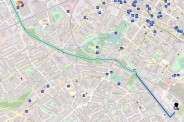 A street map shows part of Kitchener and Waterloo. There's a route trace that's mostly green and blue going from top left to bottom right. There are many small blue retables with white bike icons marked on them.